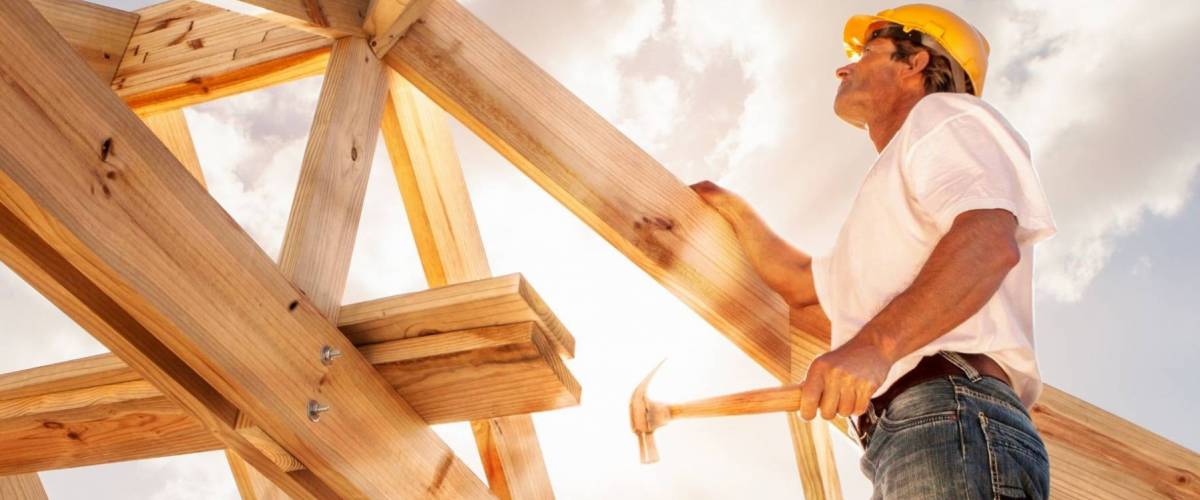 Worker building the wood frame on a home