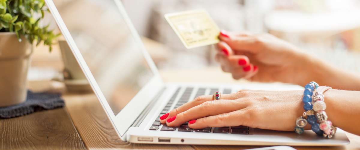Woman with computer shopping online