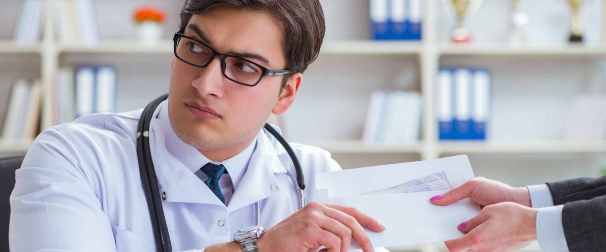 Young doctor in medical insurance fraud concept
