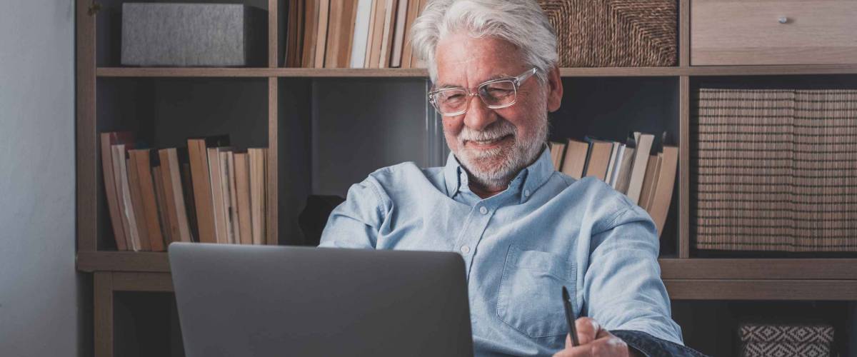 Happy mature man rest at home office