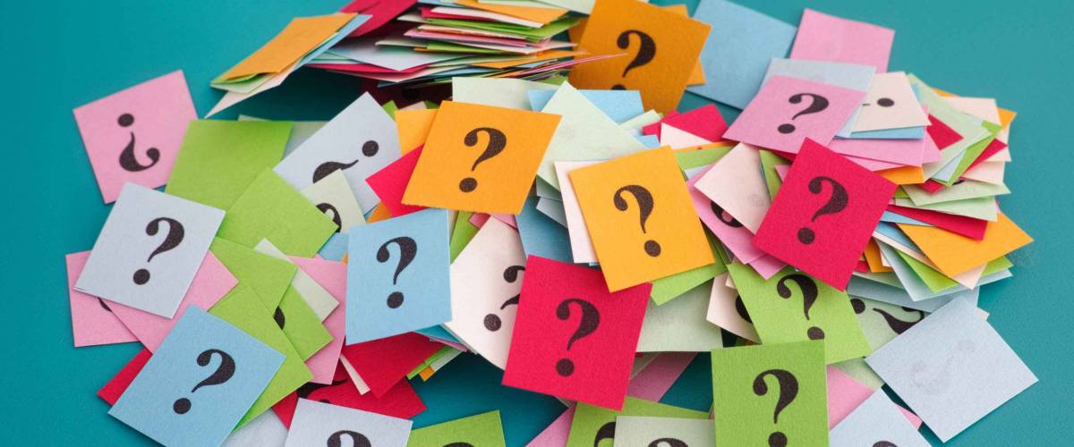 Heap of colorful question marks. Close up.