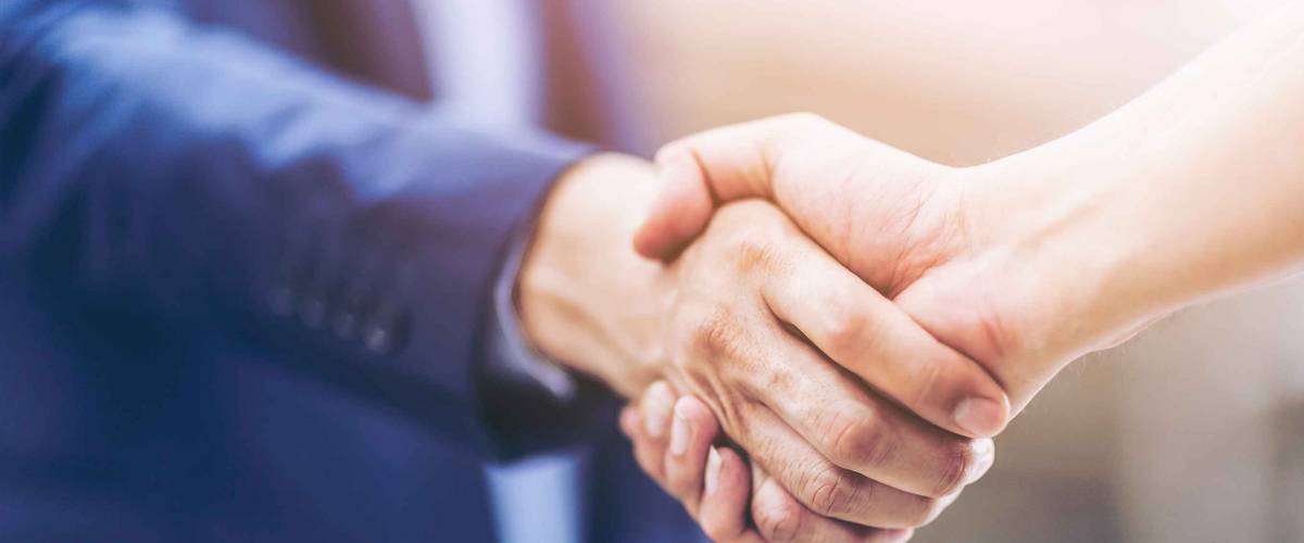 Concept of Negotiating business and handshake
