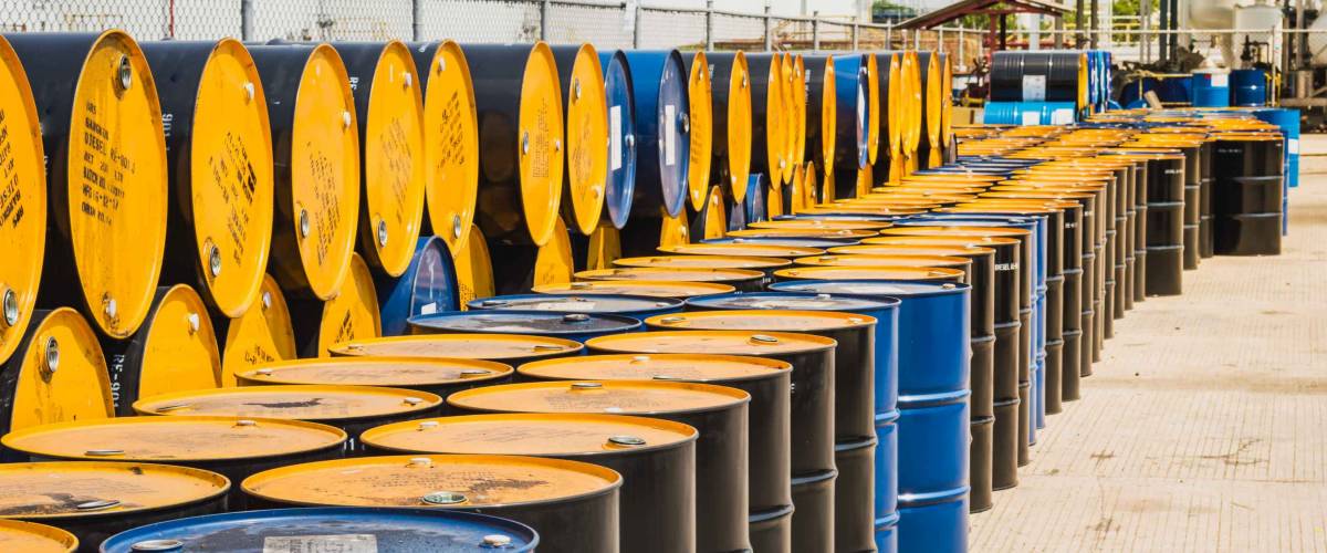 Industry oil barrels stacked up in a plant.