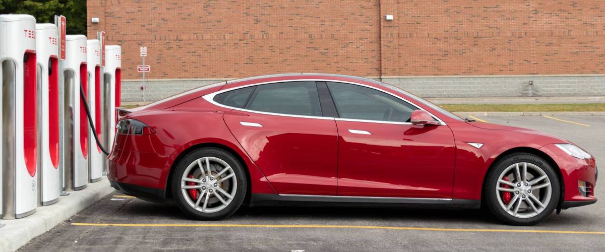 Tesla Model S while plugged-in and charging at Supercharger.
