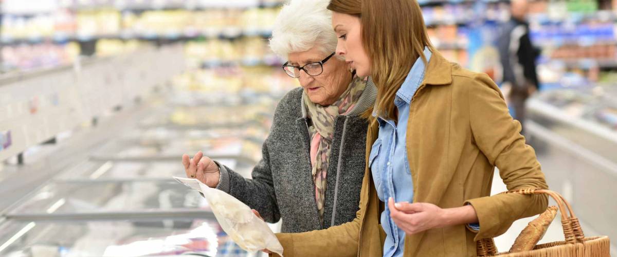 Elderly woman with young woman at the grocery store