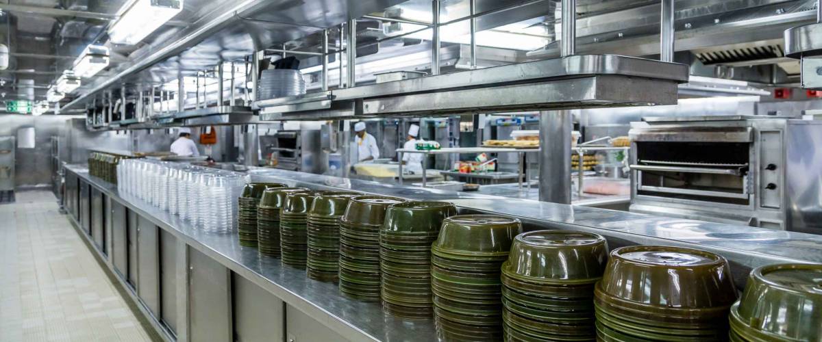 Stacks of Empty Serving Dishes in Commercial Kitchen