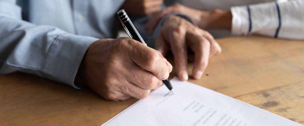 Signing contract close up