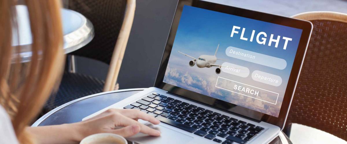 flight search on internet website, travel planning concept, airplane tickets online