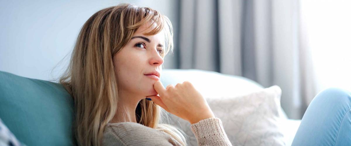 Woman at home deep in thoughts thinking and planning