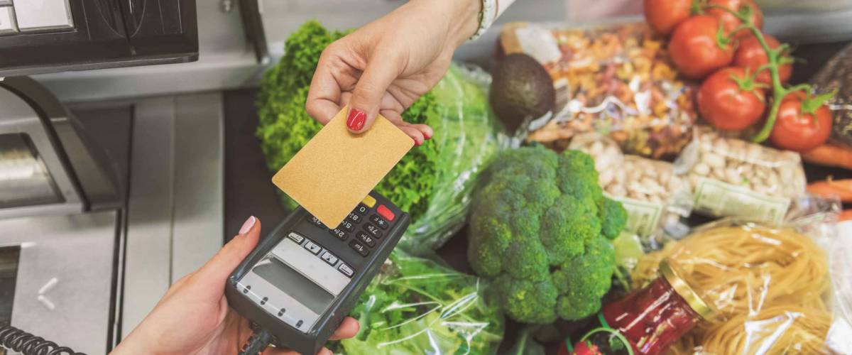 Woman going to make payment in supermarket