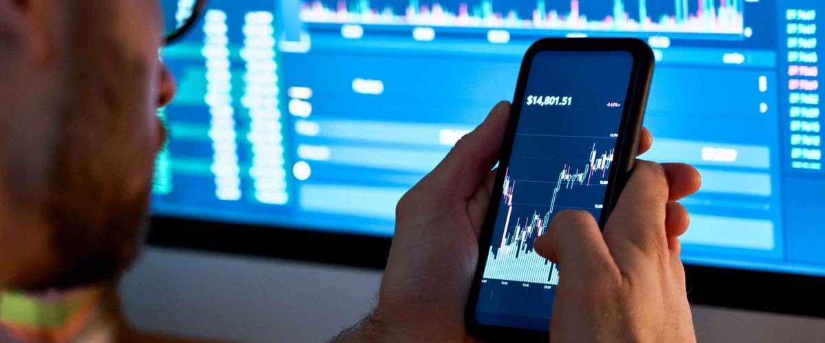 Business man trader investor analyst using mobile phone app analytics