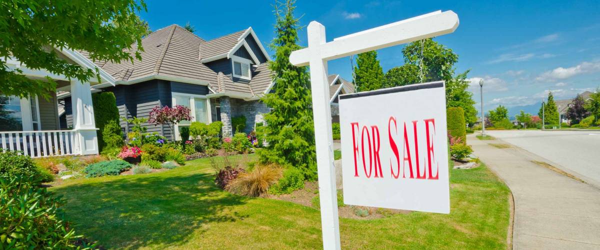 House, sign for sale for big custom made luxury house in the suburbs of Vancouver, Canada.