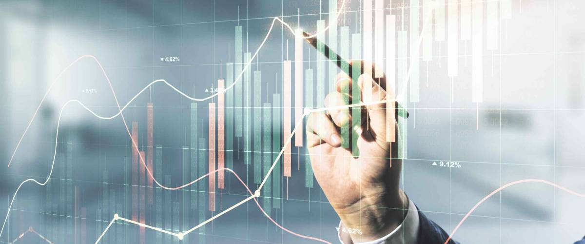 Multi exposure of businessman hand with pen working with virtual creative financial chart hologram on blurred office background, research and analytics concept