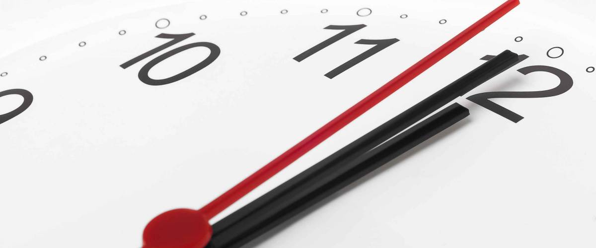 Clock countdown to midnight on white background