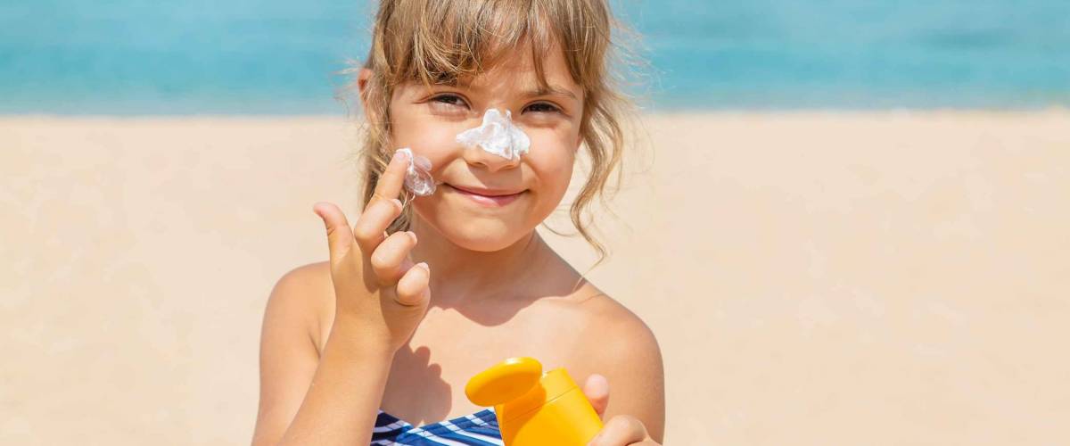 Sunscreen on the skin of a child. Selective focus.