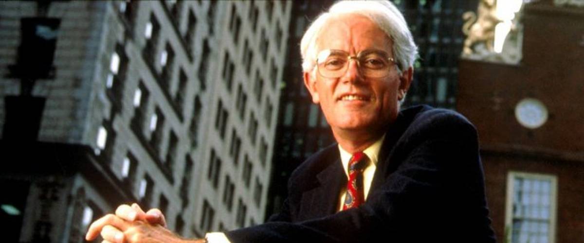 Peter Lynch seen from below on a busy street.
