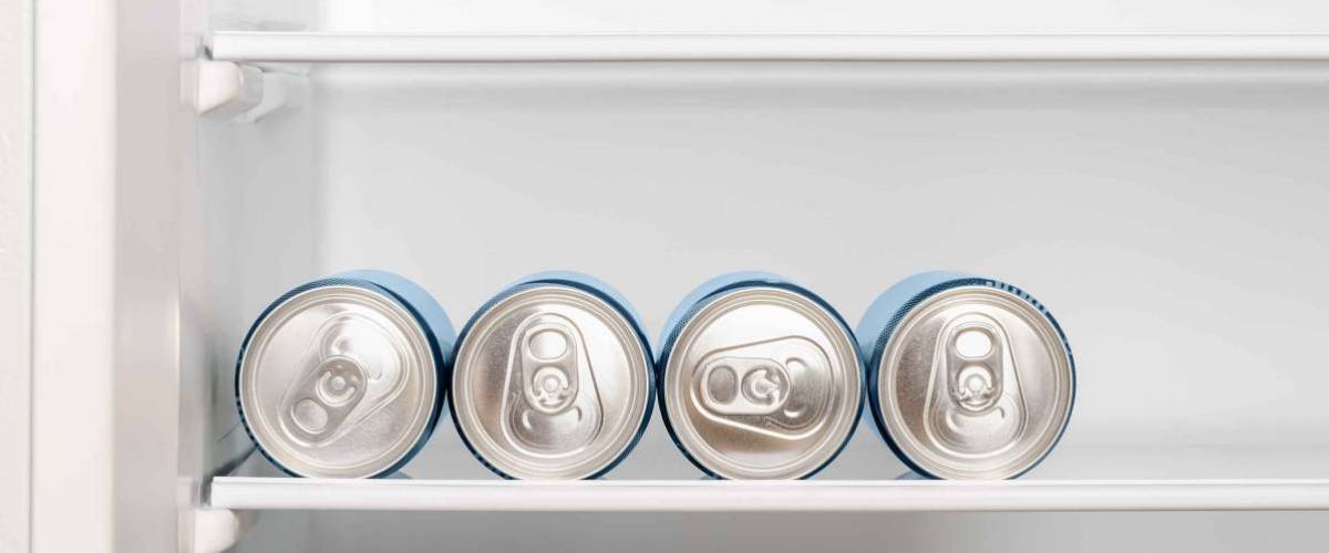 Cans of soda in refrigerator
