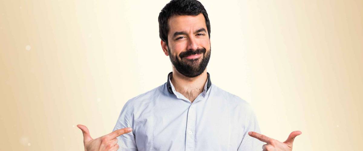 Man proud of himself over ocher background