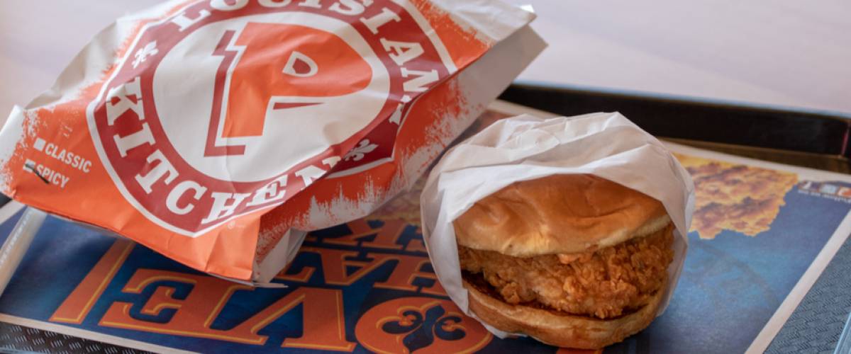 A spicy chicken sandwich from Popeyes fast food restaurant.