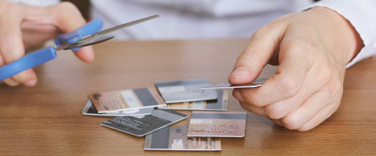 Image of scissors and cutting credit cards.