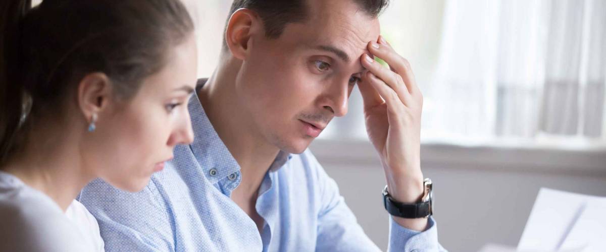 Man and woman reading contract