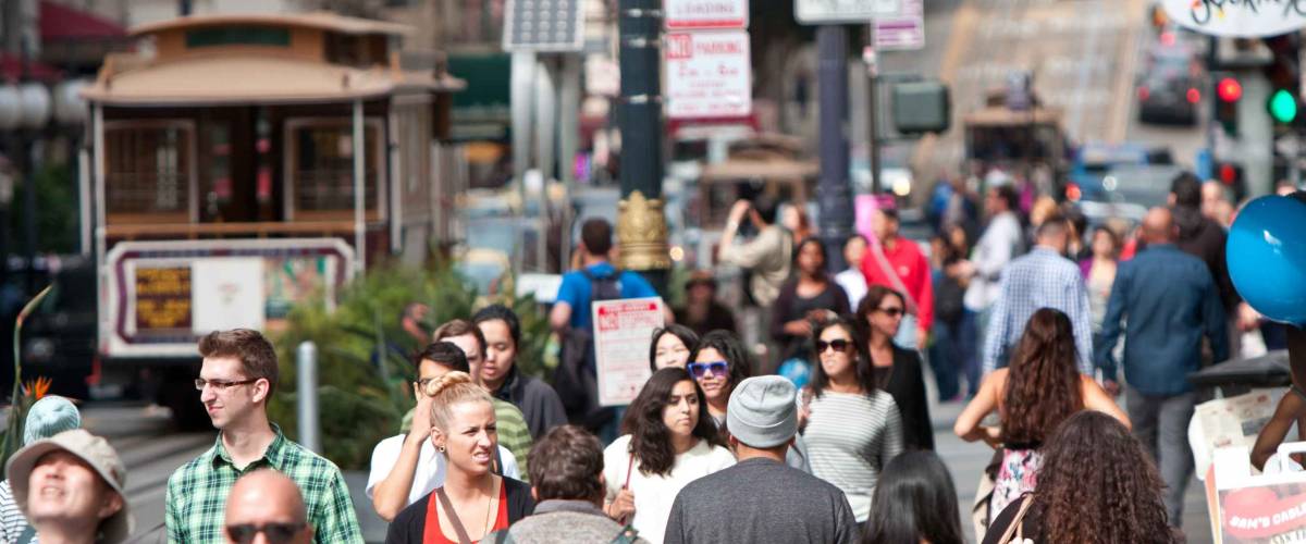 SAN FRANCISCO, CA - OCTOBER 17: A huge crowd of tourists, shoppers and locals walk up and down Powell Street in San Francisco.