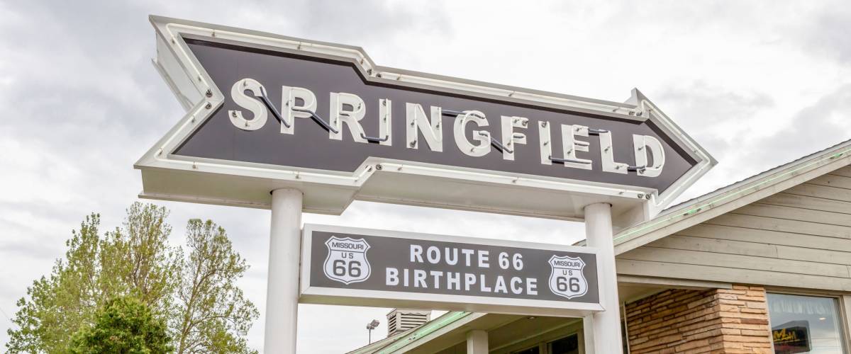 Springfield Missouri, USA- May 18, 2014. Springfield road arrow sign with cafe background in best western route 66 rail haven.