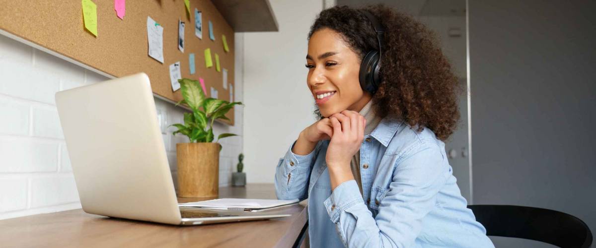 Smiling young african american woman working from home