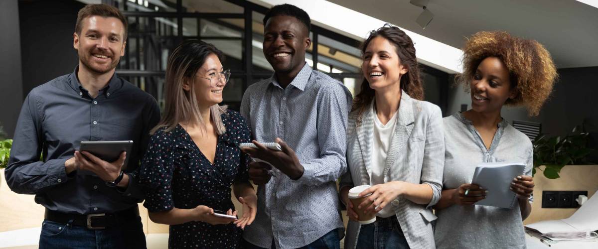 Cheerful happy multicultural business team people laughing joking