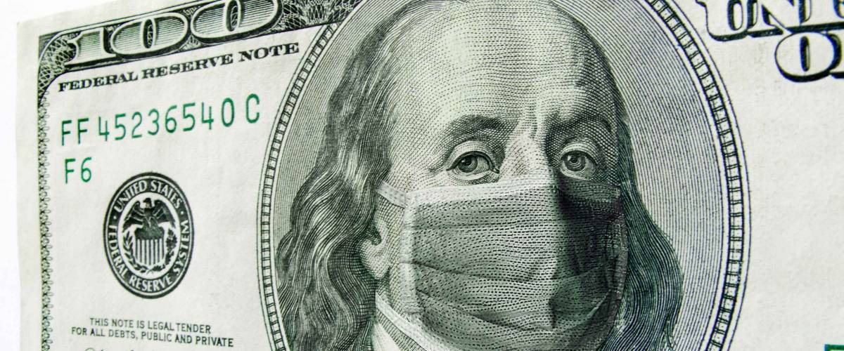 This photo illustration of Ben Franklin wearing a healthcare surgical mask on a one hundred dollar bill.