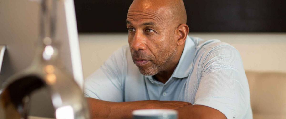 African American man having computer problems.