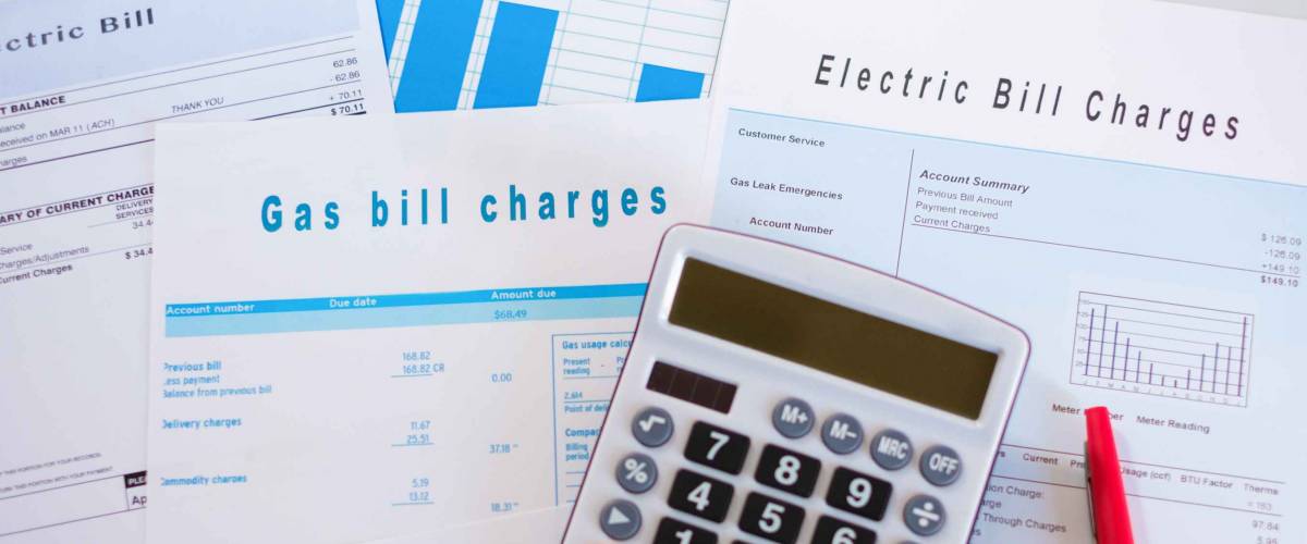 Energy efficiency concept with charges invoice documents on desk