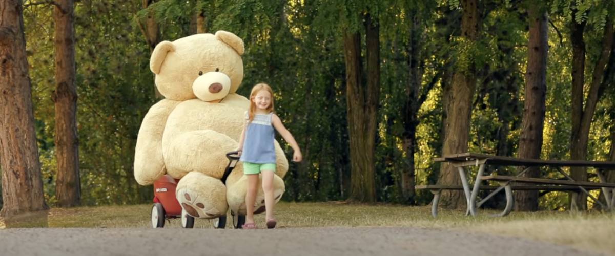 93 inch teddy bear and young girl