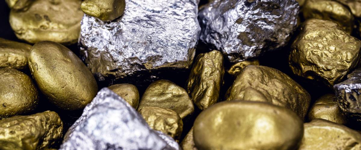 Gold and silver nuggets on black background. Precious stones, luxury concept and mineral drainage. Industrial activity, treasure and fortune.