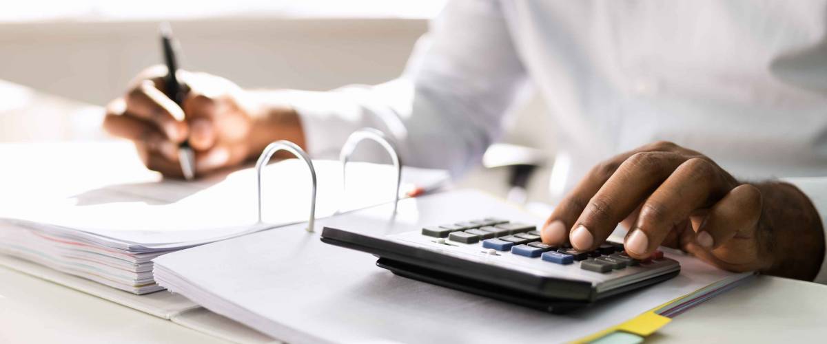 African American Accountant Doing Accounting And Tax