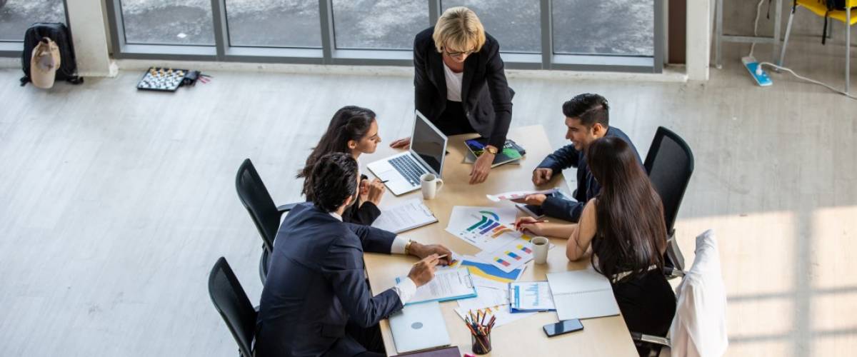 Top view on group of business people meeting at table