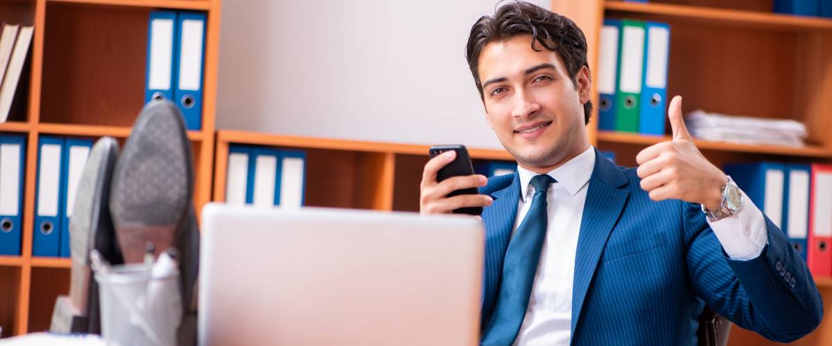 Young handsome businessman working in the office