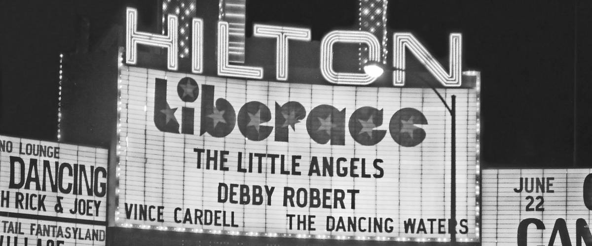 LAS VEGAS – JUNE22, 1979: Hilton Hotel and Liberace show logo in Las Vegas Boulevard. Vintage picture taken in 1979.