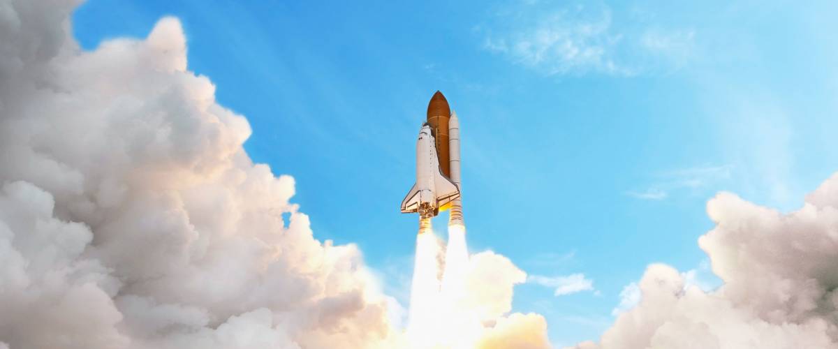 Space shuttle taking off on a mission. Spaceship flying in the sky