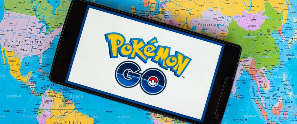 KUALA LUMPUR, MALAYSIA - 12 JULY 2016: Pokemon Go is a free-to-play, GPS based augmented reality mobile game . The game become hits around the world. (picture with world map background).