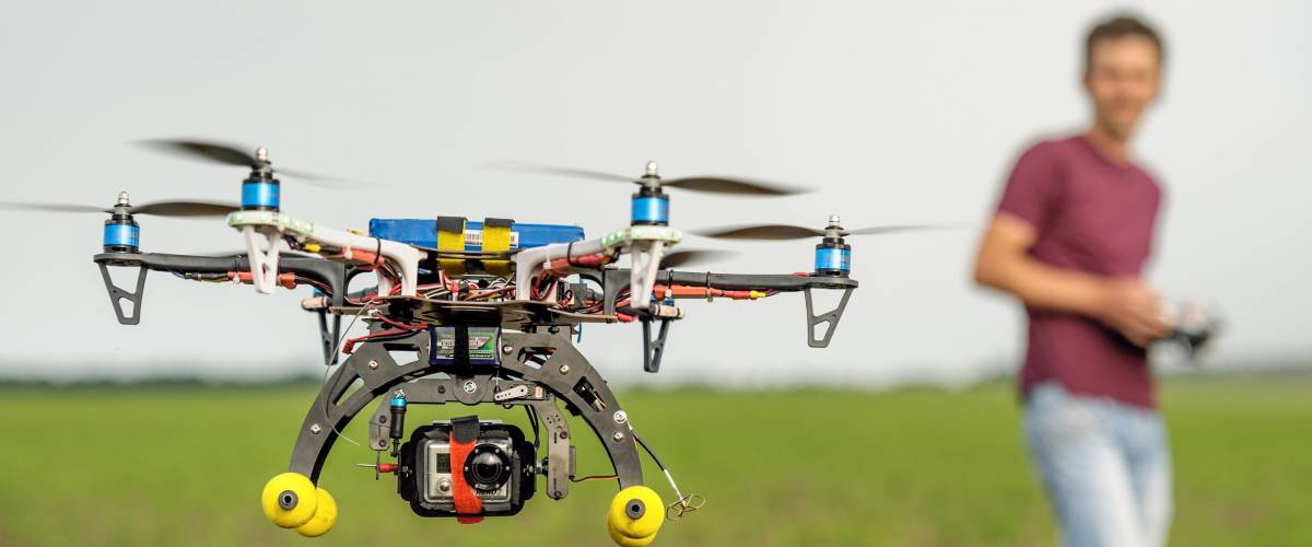 Demonstration of unmanned copter. Man quadrocopter flight controls. Zhitomir region Ukraine. 05/30/2013