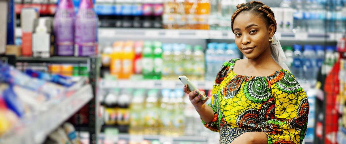 Woman shopping holding a mobile phone