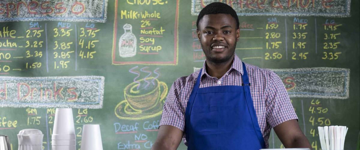 Portrait of a proud cafe worker