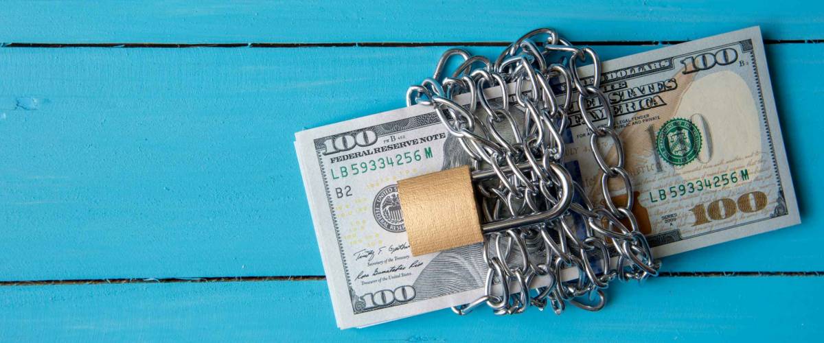 locked dollar money by metal chain link with padlock