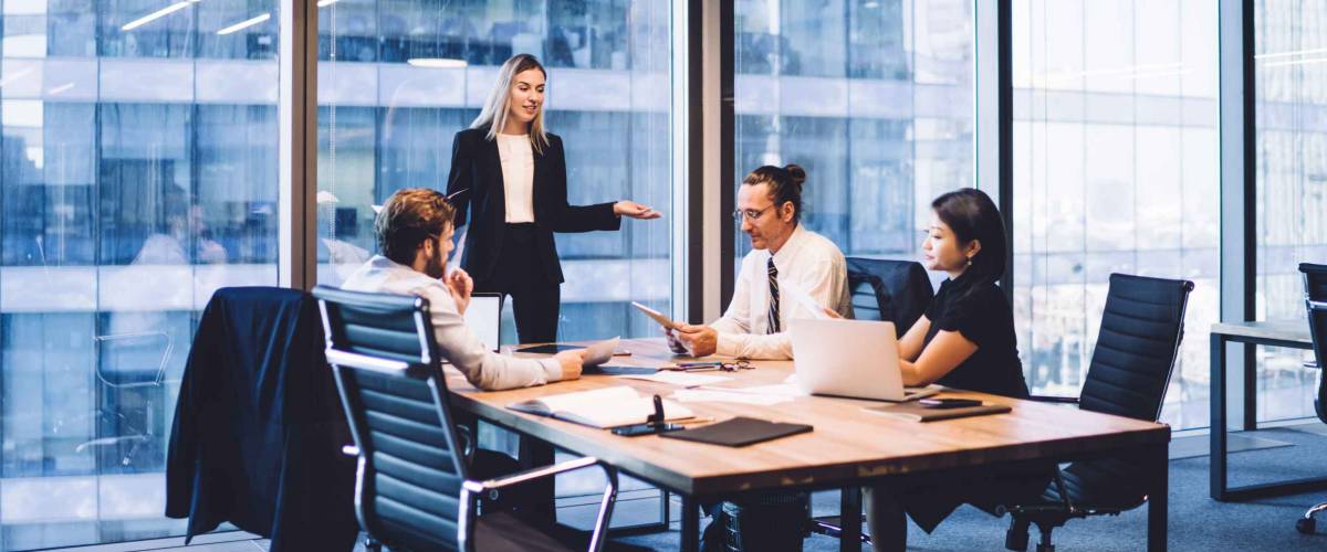 businesswoman providing information to corporate workers of company