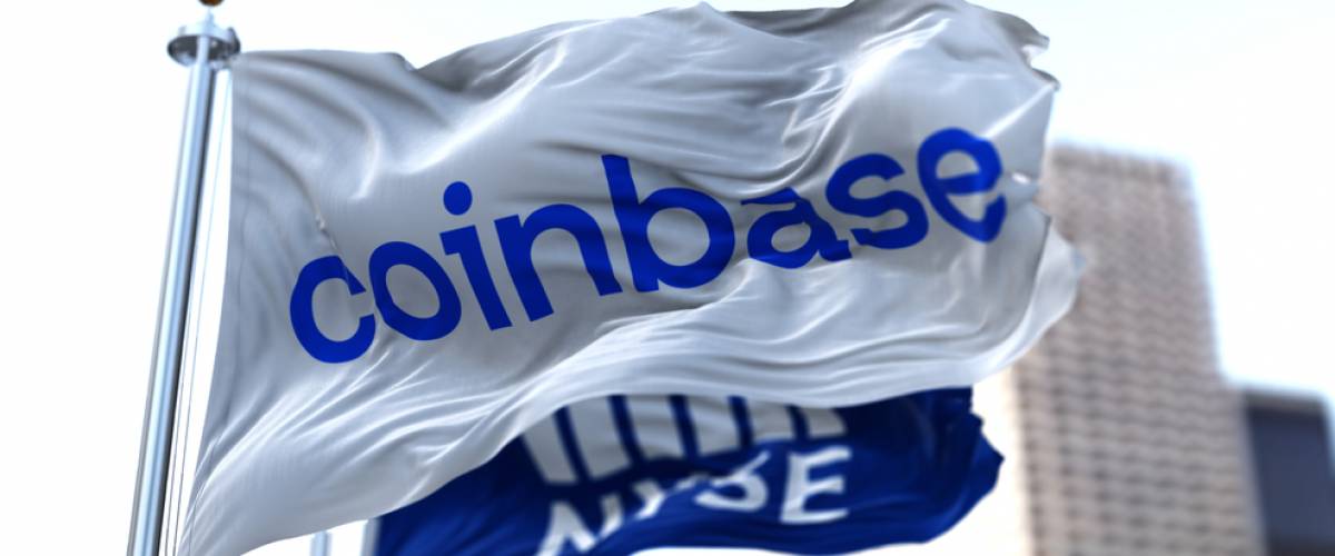 Flags of Coinbase and NYSE flying in the wind.