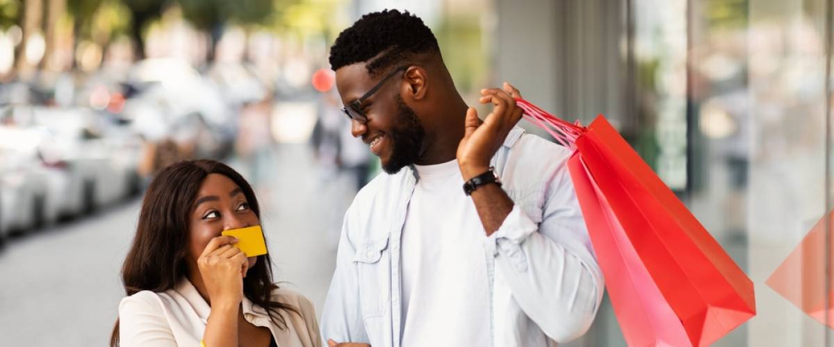 A couple carrying holiday shopping bags
