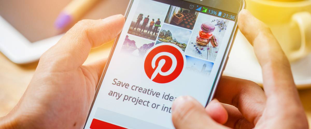 The login page for the social media site Pinterest on a cell phone screen.