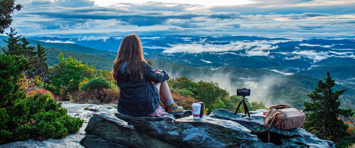 Woman enjoying the Blue Ridge mountains sunrise