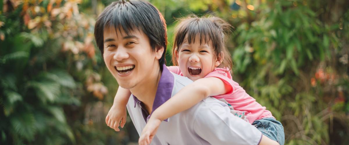 Father and daughter laughing